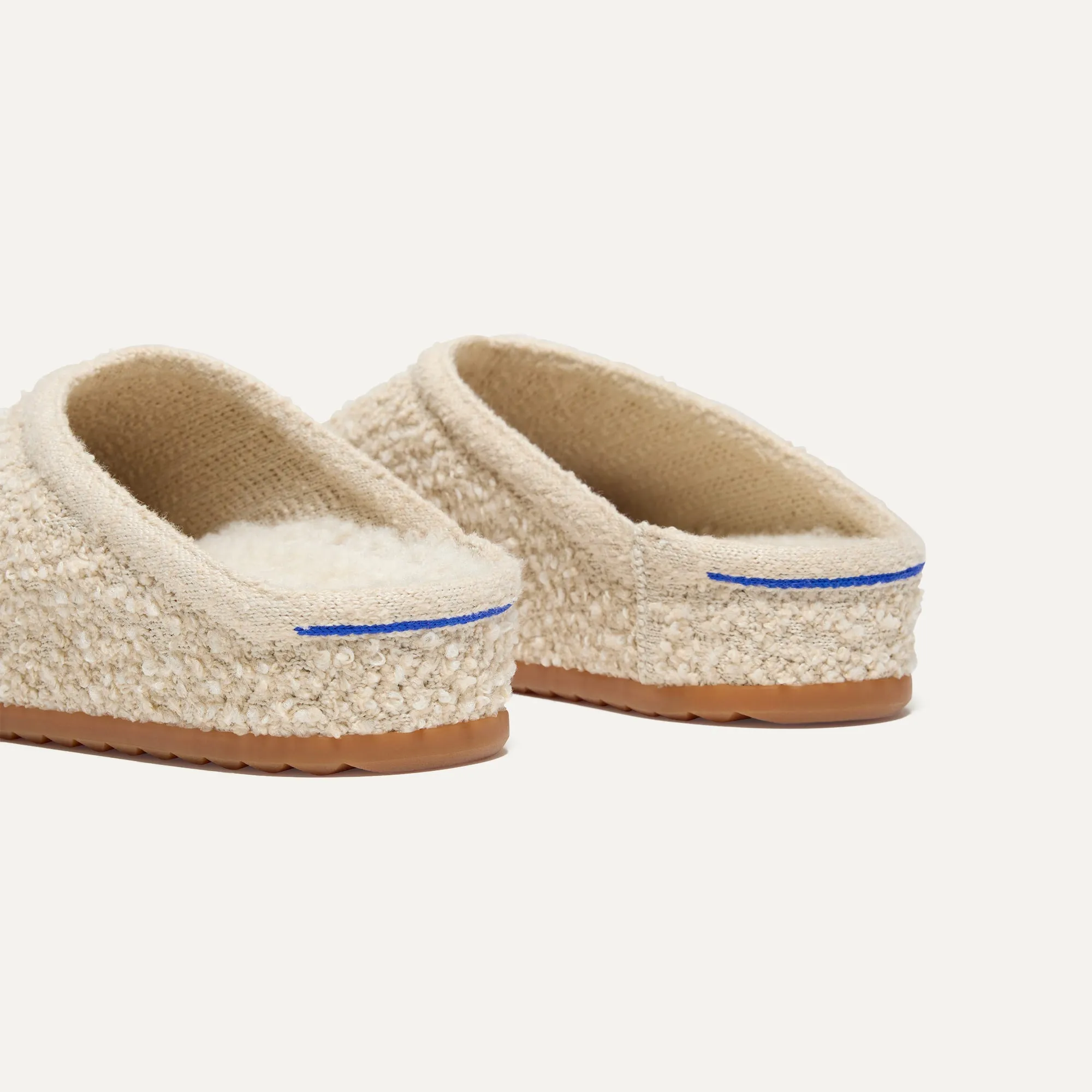 The Cozy Clog - Honeybun Bouclé. Optimize the title of this e-commerce product and return a version with descriptive modifiers.

Optimized Title: Warm and Plush Honeybun Bouclé Cozy Clog Slippers