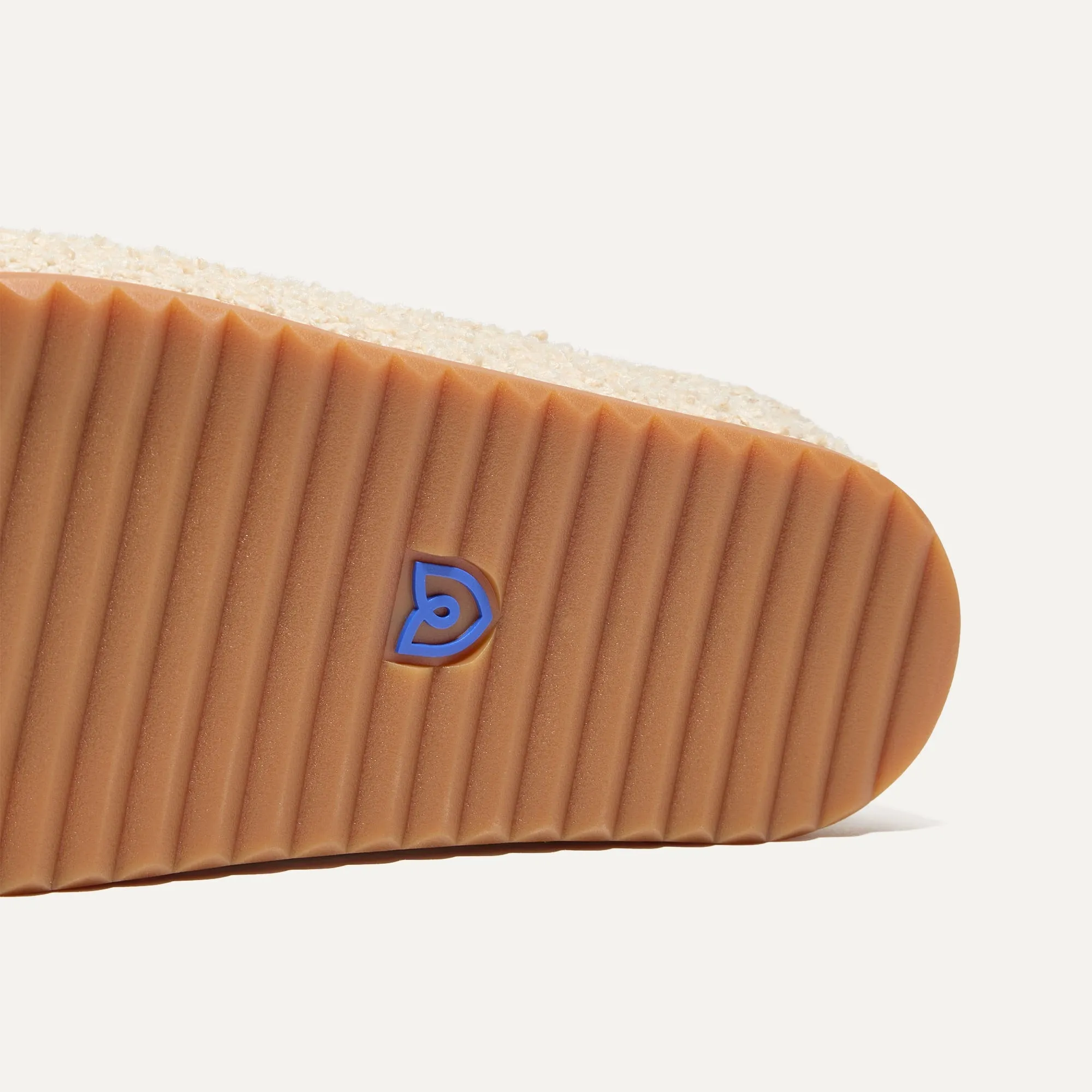 The Cozy Clog - Honeybun Bouclé. Optimize the title of this e-commerce product and return a version with descriptive modifiers.

Optimized Title: Warm and Plush Honeybun Bouclé Cozy Clog Slippers